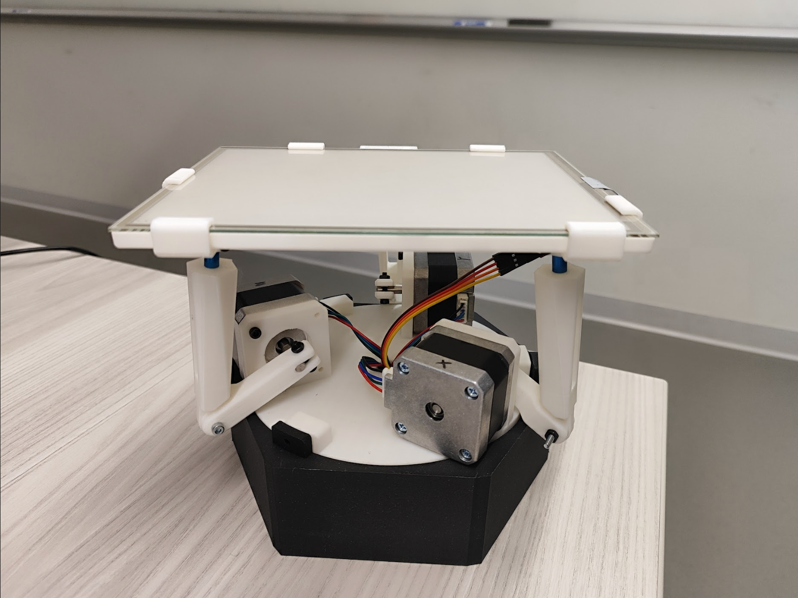 Ball-balancing robot demonstrating real-time stabilization on a touchscreen platform.